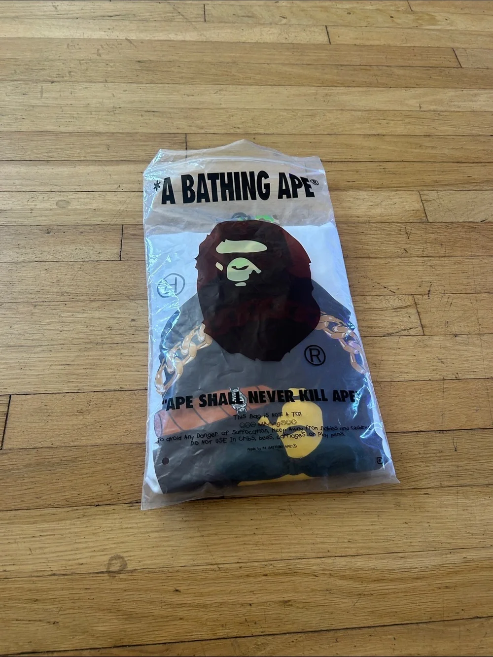 A Bathing Ape Kids White Graphic Ape Tee with Gold Chain Print